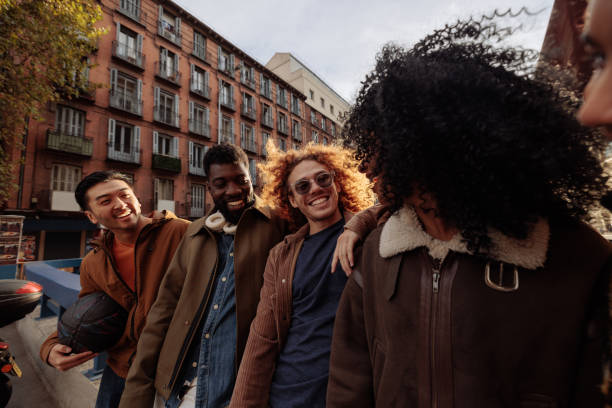 istock Happy multiracial friends walking together in Madrid 2196737123