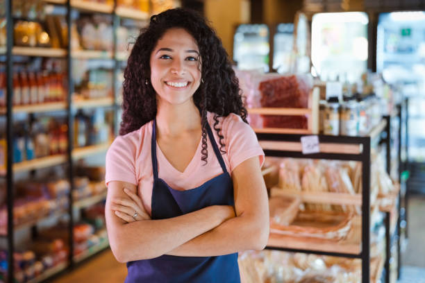 istock Smiling female entrepreneur with arms crossed 2196738182