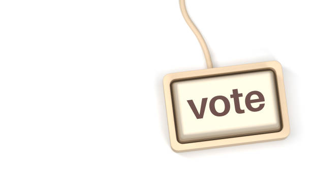 The button symbolizes participation, elections, polls, online voting, and digital engagement in democratic A close-up of a computer keyboard with the word Vote displayed on the keys.