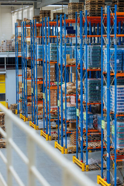 istock Organized warehouse with tall shelving units 2196740293