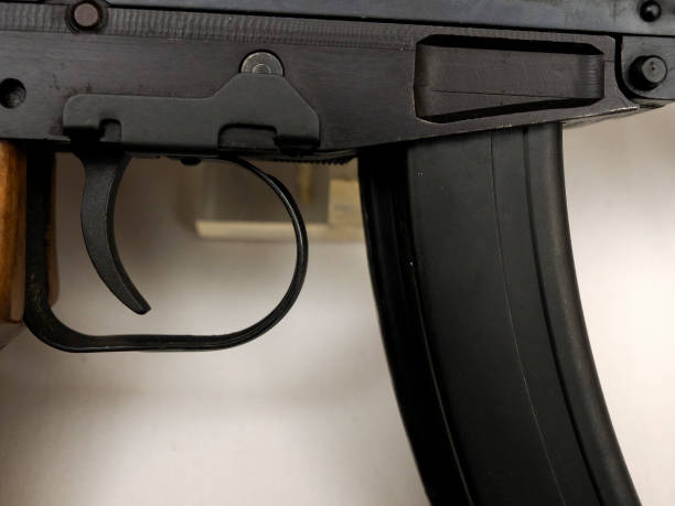 istock pistol gun trigger detail close up 2196741380