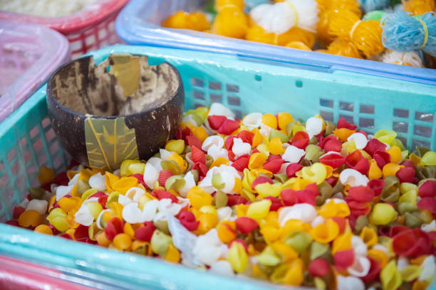 istock Shell macaroni tricolor in large plastic basket with coconut shell scoop, clear liner, mixed pasta, helical corkscrew fusilli, vegetable flat noodle at local market, Can Tho, Vietnam, raw vegan 2196741407