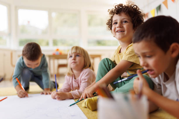 istock Children having fun drawing in the kindergarten 2196744776