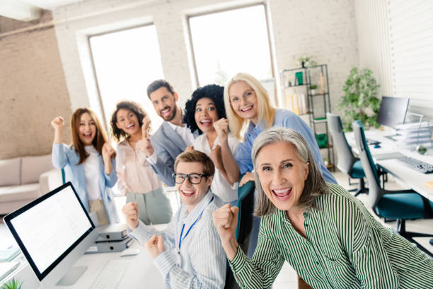 istock Professional business team celebrating success together in a modern office 2196745272