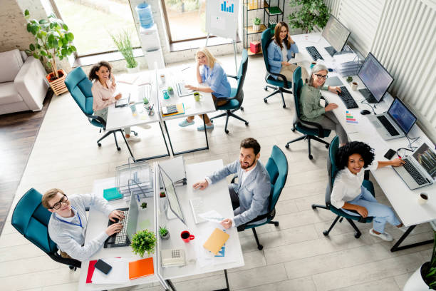 istock Diverse team working collaboratively in modern office setting, showcasing professionalism and cooperation, top view 2196745304