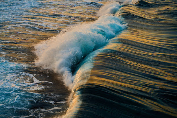 Waves break at sunset slow shutter speed. Egypt. Red Sea. Africa.