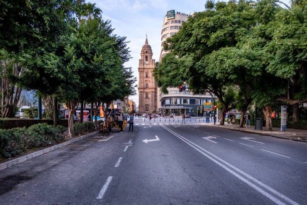 October 11, 2024, Malaga, Spain - Street view with Malaga Cathedral - Malaga, Andalusia, Spain