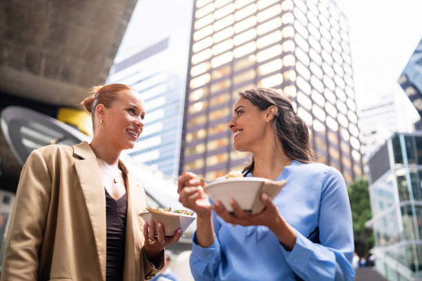 istock Professional Women Enjoying Lunch Outdoors in Downtown Sydney 2196749921
