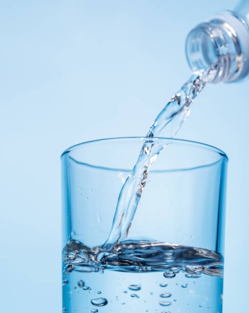 istock Crystal clear water being poured into a transparent glass, creating refreshing ripples and bubbles 2196750674