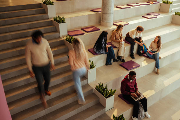 istock University students studying and walking in modern bleacher-like classroom 2196756673