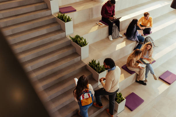 istock University students collaborating and studying in modern campus area 2196756674