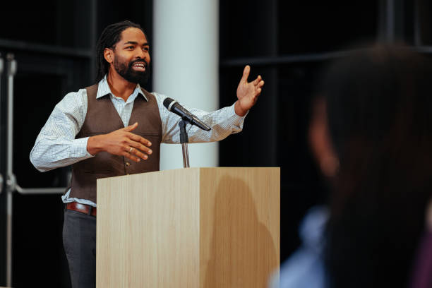 Motivational speaker inspiring audience with engaging presentation