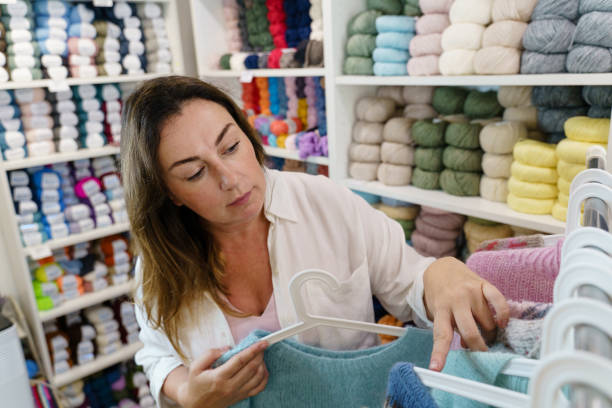 istock Female fashion designer working at her yarn studio 2196756795