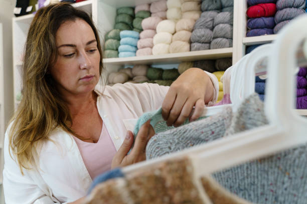 istock Woman working with the handmade sweater collection 2196757026