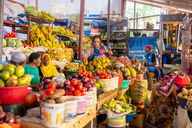 Local market in Arusha Tanzania Arusha, Tanzania - November 16, 2024: Woman selling their goods at the colorful local market in Arusha in Tanzania East Africa arusha region stock pictures, royalty-free photos & images