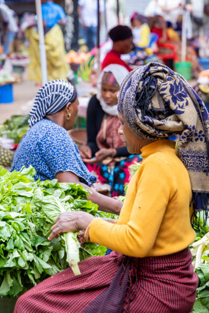 Local market in Arusha Tanzania Arusha, Tanzania - November 16, 2024: Woman selling their goods at the colorful local market in Arusha in Tanzania East Africa arusha region stock pictures, royalty-free photos & images