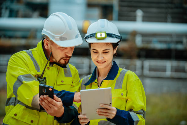 istock Colleagues discussing project details while wearing safety gear in an industrial facility 2196758944