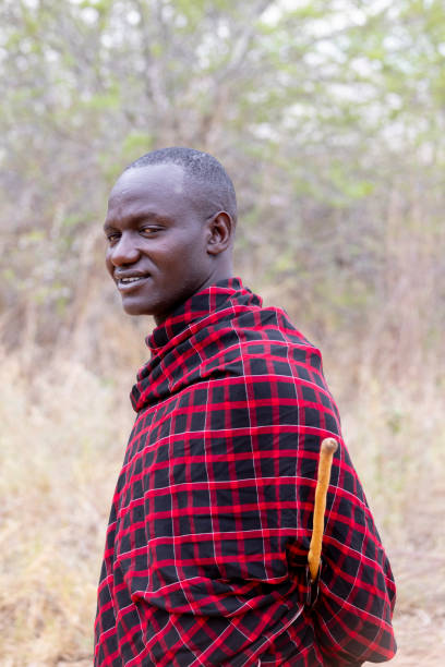 Kwa Kuchinia, Tanzania - November 19, 2024: Portrait of Masai man in traditional clothing at Econscience Luxery Lodge in Kwa Kuchinia in Tanzania in East Africa