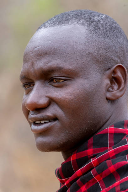 Kwa Kuchinia, Tanzania - November 19, 2024: Portrait of Masai man in traditional clothing at Econscience Luxery Lodge in Kwa Kuchinia in Tanzania in East Africa