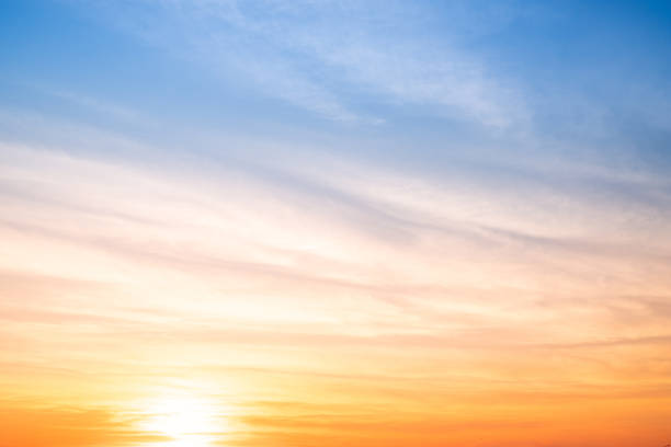 istock Sky,sunset, beautiful , luxury soft gradient orange gold clouds and sunlight on the blue sky perfect for the background, Sunrise on morning or everning in winter warm time ,Twilight summer,silhouette 2196760010