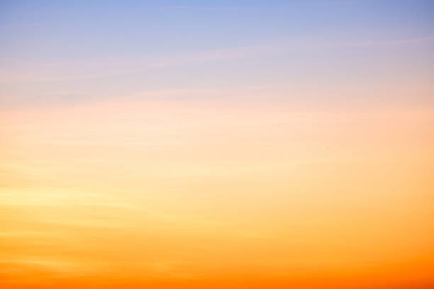 istock Sky,sunset, beautiful , luxury soft gradient orange gold clouds and sunlight on the blue sky perfect for the background, Sunrise on morning or everning in winter warm time ,Twilight summer,silhouette 2196760134