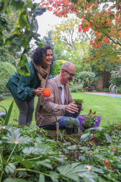 istock Smiling mature couple in garden 2196761176