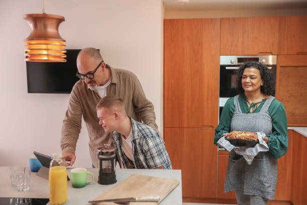 istock Family with adult son in kitchen 2196762267
