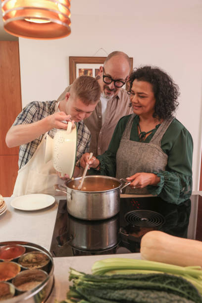istock Parents cooking with adult son 2196762622