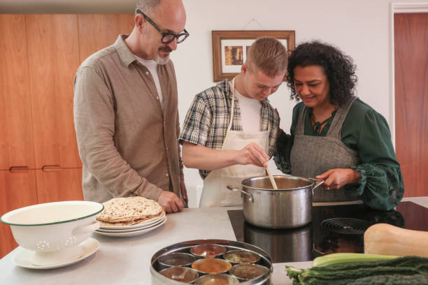 istock Parents cooking with adult son 2196762661