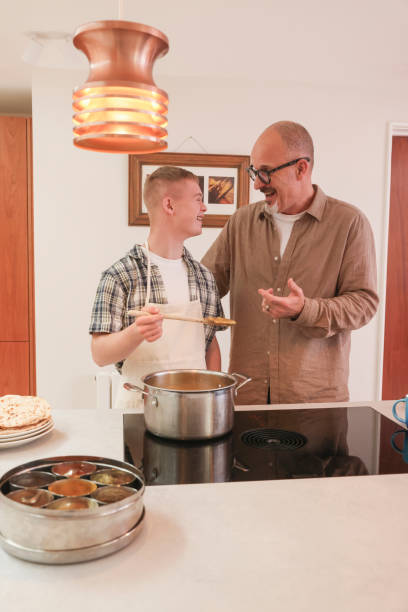 istock Father cooking with adult son 2196762700