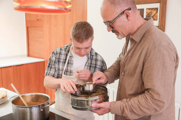 istock Father cooking with adult son 2196762706