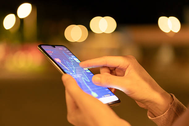 istock A trader is analyzing financial data on a digital mobile online trading platform. 2196763093