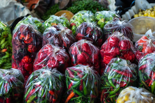 istock Peppers in a plastic bag for sale at a stand. 2196764519