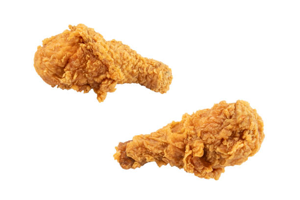 istock Two of fried chicken drumsticks isolated on white background 2196764679