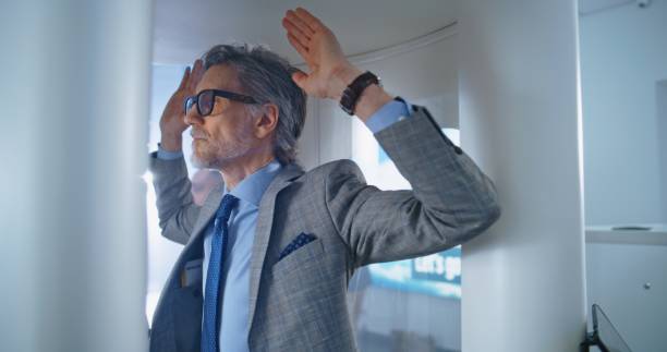 istock Airport Terminal: Mature Man Walks Through Metal Detector Scanner Gates 2196765593