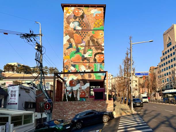 Seoul, South Korea – January 24, 2025: Colorful mural on a building in Seoul, South Korea, under a clear blue sky, showcasing urban art and street culture.