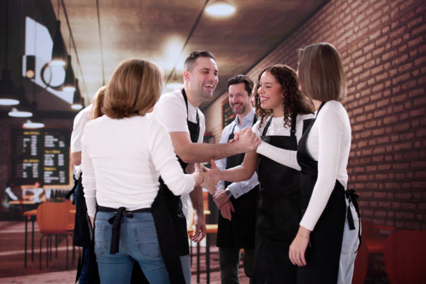 Chef Welcomes New Employee with Handshake