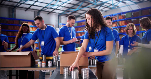 istock Community volunteers sorting donated food items 2196768405
