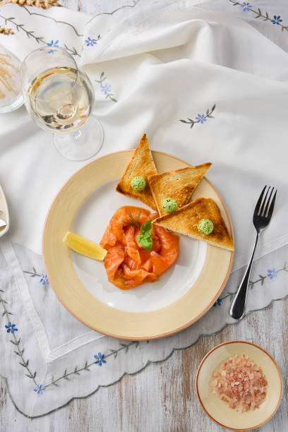 istock Gourmet Lightly Salted Salmon with Toasts on Elegant Table Setting 2196768769