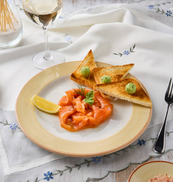 istock Elegant Gourmet Lightly Salted Salmon with Toasts in a Soft Pastel Setting 2196769045