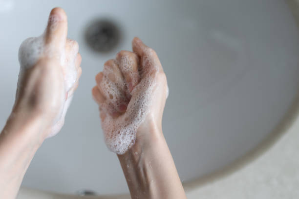 istock Young boy washes his hands in the bathroom 2196770079