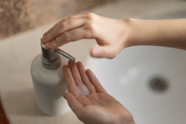 istock Young boy washes his hands in the bathroom 2196770198