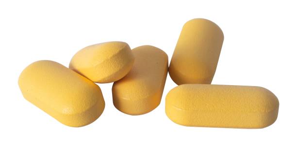 istock yellow medical capsules isolated element 2196771165