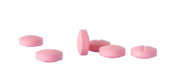 istock pink medical pills tablets isolated element 2196771212