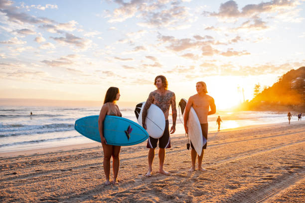 istock Young Surfers Enjoying Morning on Gold Coast Beach 2196773392