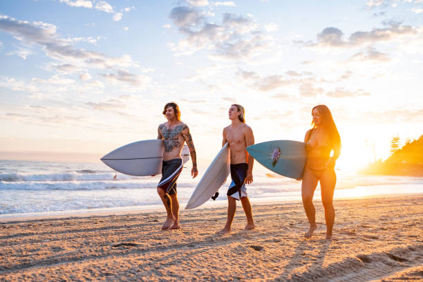 istock Surfers on Gold Coast Beach at Sunrise 2196773409