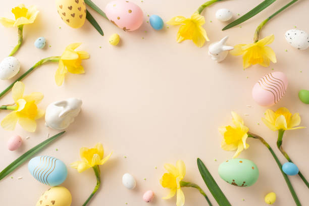 istock Festive composition with colorful eggs, yellow daffodils, and cute figurines, perfect for Easter decor 2196774497