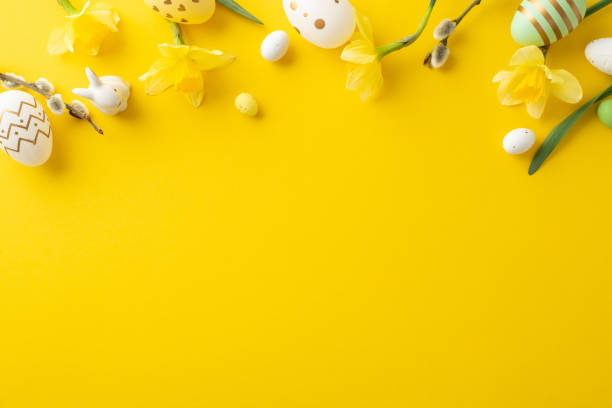 istock Colorful Easter eggs and yellow daffodils accentuate a vibrant yellow setting, evoking spring 2196774505
