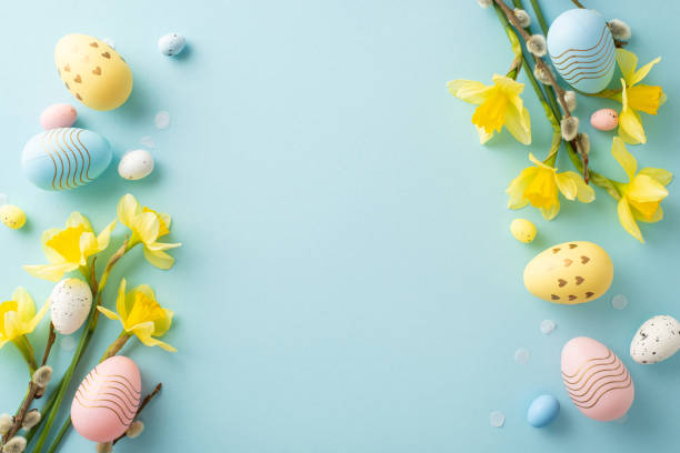 istock Lovely arrangement of pastel Easter eggs, yellow blossoms, and decorative elements portraying springtime 2196774511