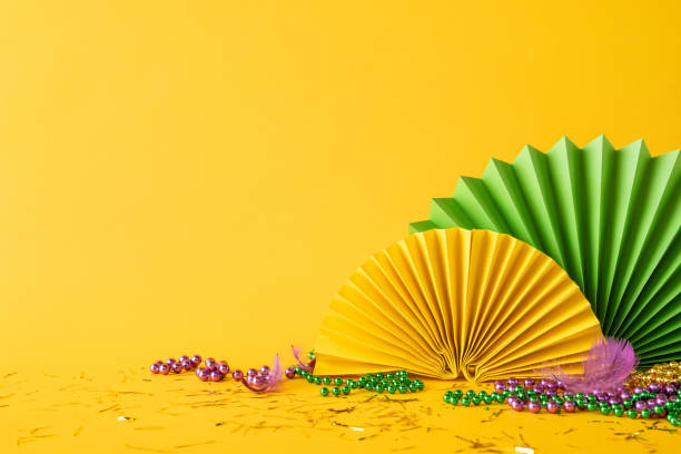 istock Colorful side view Mardi Gras celebration featuring decorations, paper fans, shiny beads, and festive details 2196774545